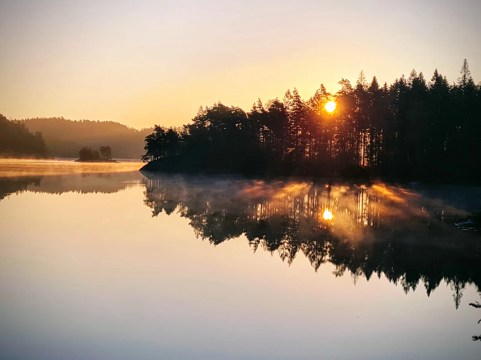 Pristine forest lake in northern Bullaren, ideal for late-summer swimming.
