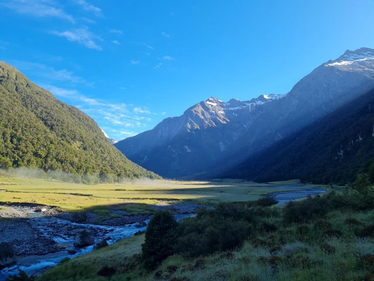 Alpine valley with meandering river and snow-capped peaks in morning light, Gillespie Pass Circuit.