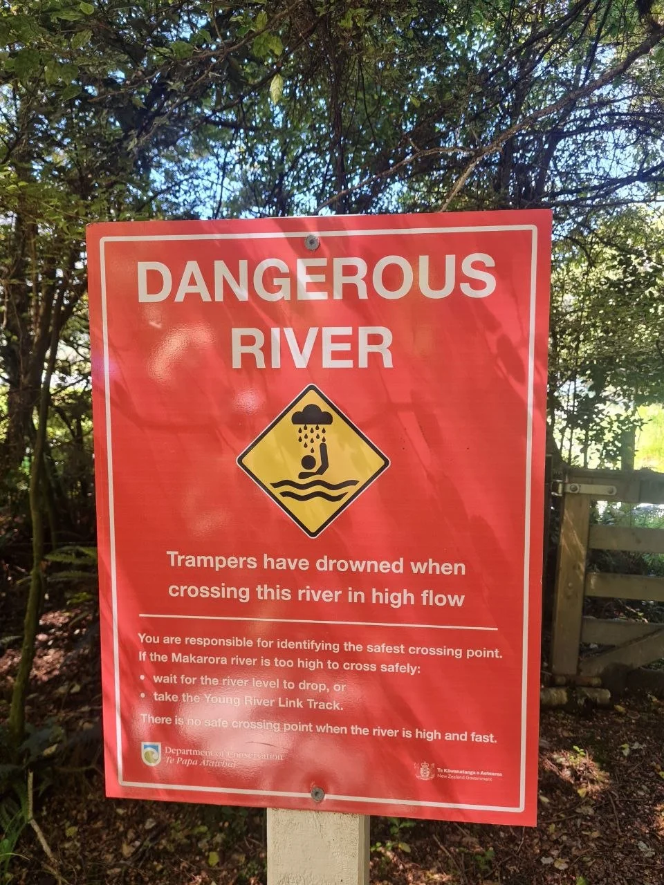 DOC warning sign at the Makarora River crossing, Gillespie Pass Circuit trailhead.