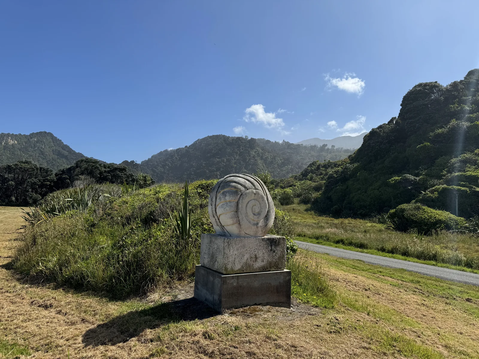 Stone carving of the endemic giant land snail Powelliphanta, a carnivorous ancient species protected within Kahurangi National Park.