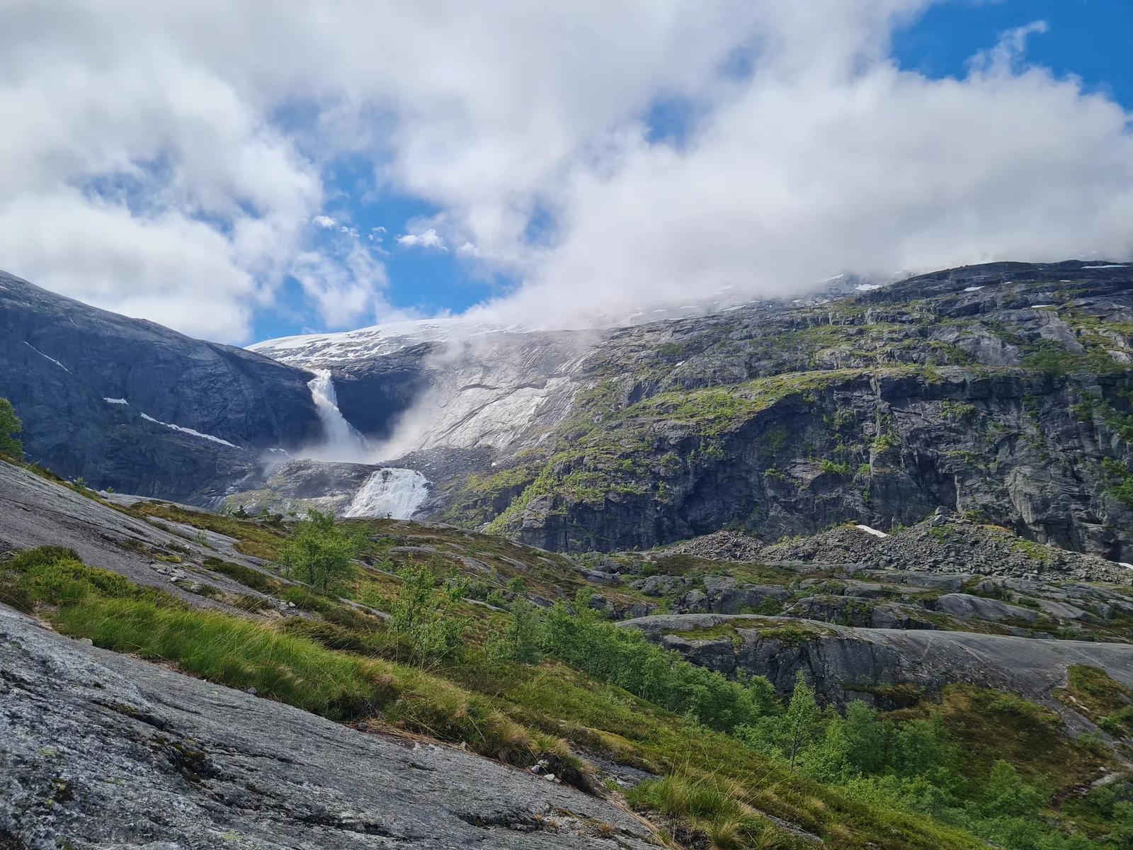 Søtefossen waterfall thundering down the colossal granite headwall into cloud and mist.