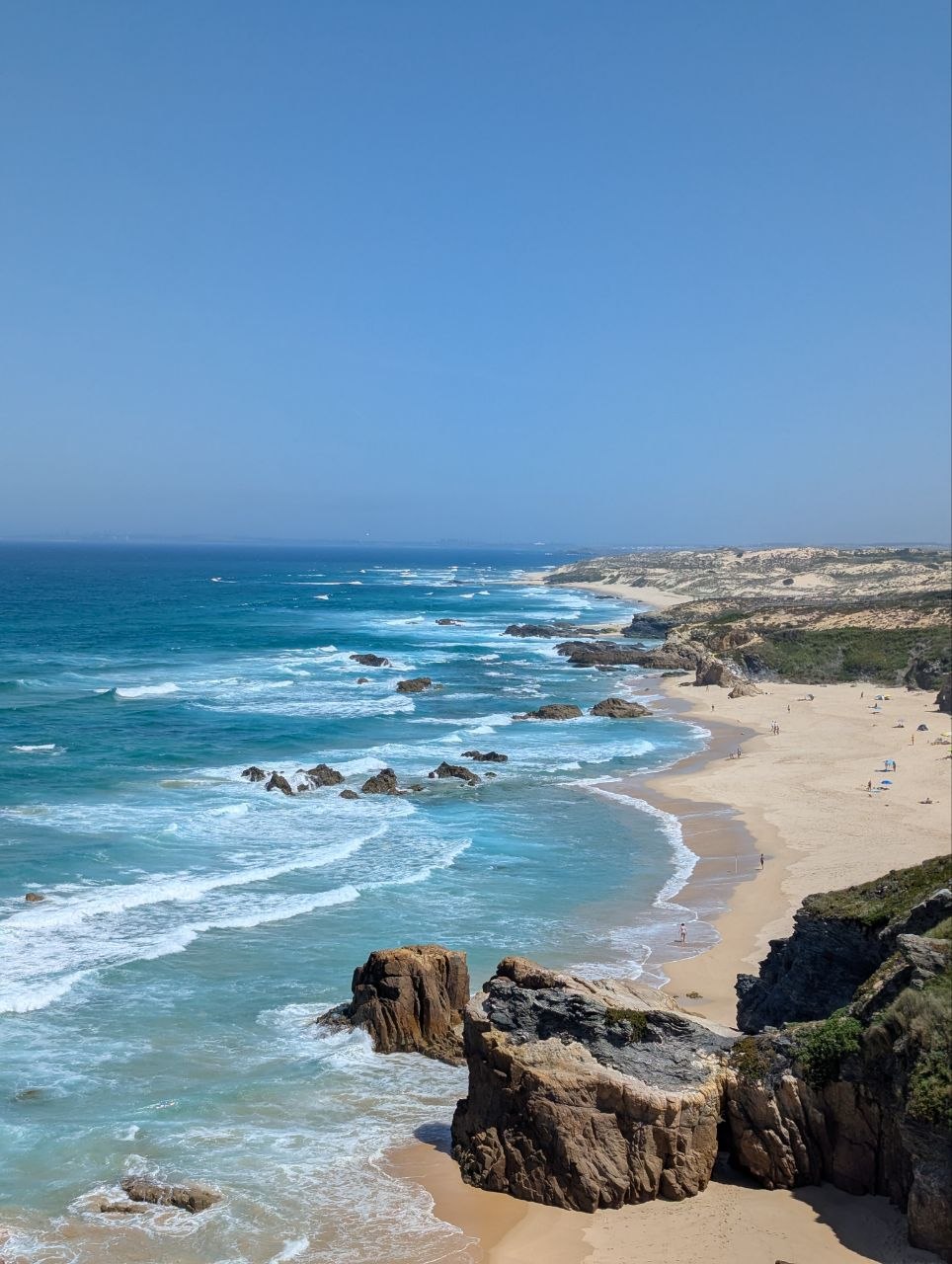 Rocky coastline and sandy beach along the Rota Vicentina