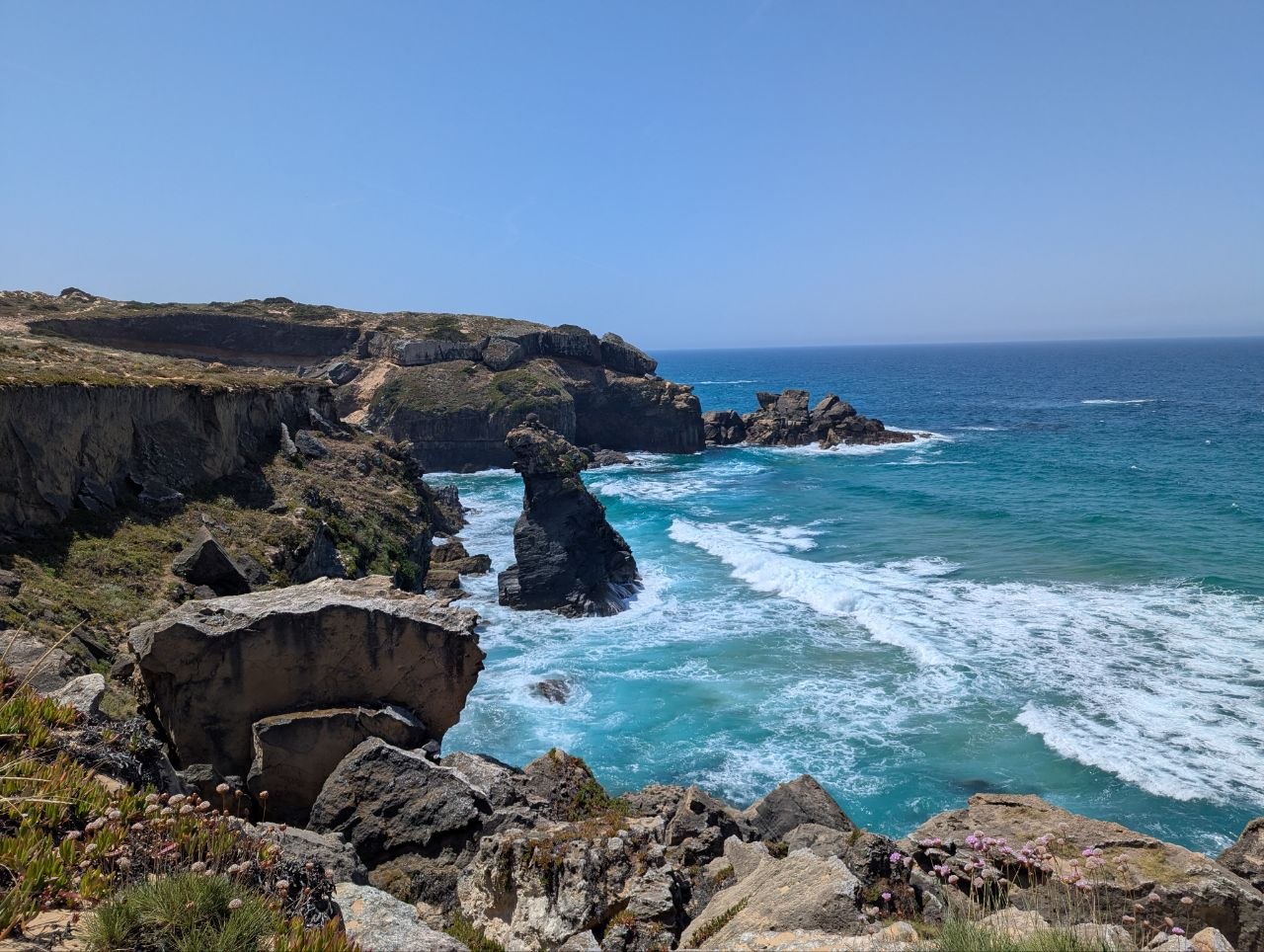 Rocky coastline with turquoise waves on Rota Vicentina