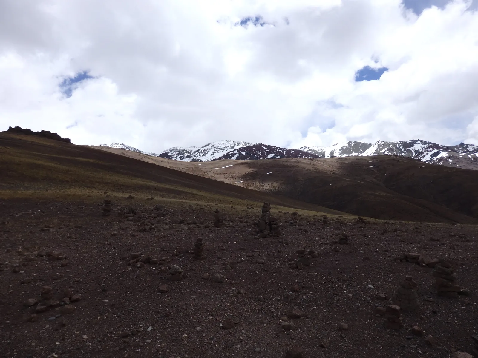 Ancient stone cairns marking the desolate pass plateau of Kyamar La at 4,870 m.