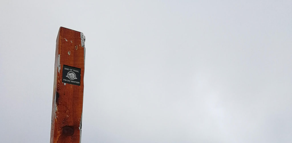 Glacier Crest Trail: End of trail sign covered in clouds